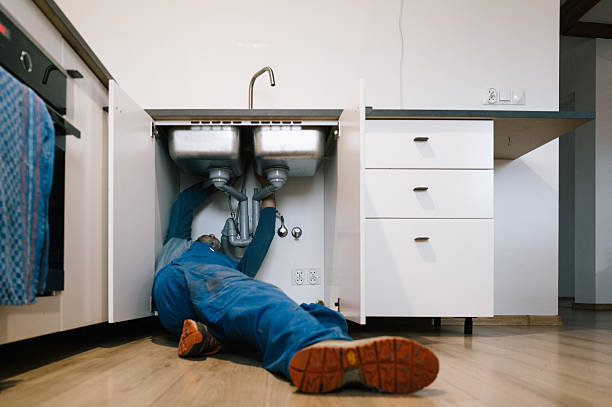 Professional Emergency Plumber technician working in Henderson, MD